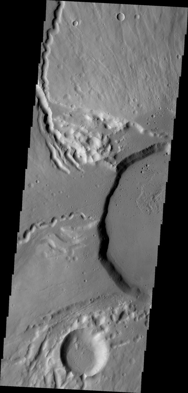 This image from NASA Mars Odyssey shows part of the summit of Ceraunius Tholus.