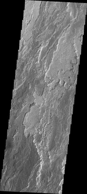 Daedalia Planum was created by extensive lava flows from Arsia Mons. This image from NASA Mars Odyssey shows a small portion of those flows.