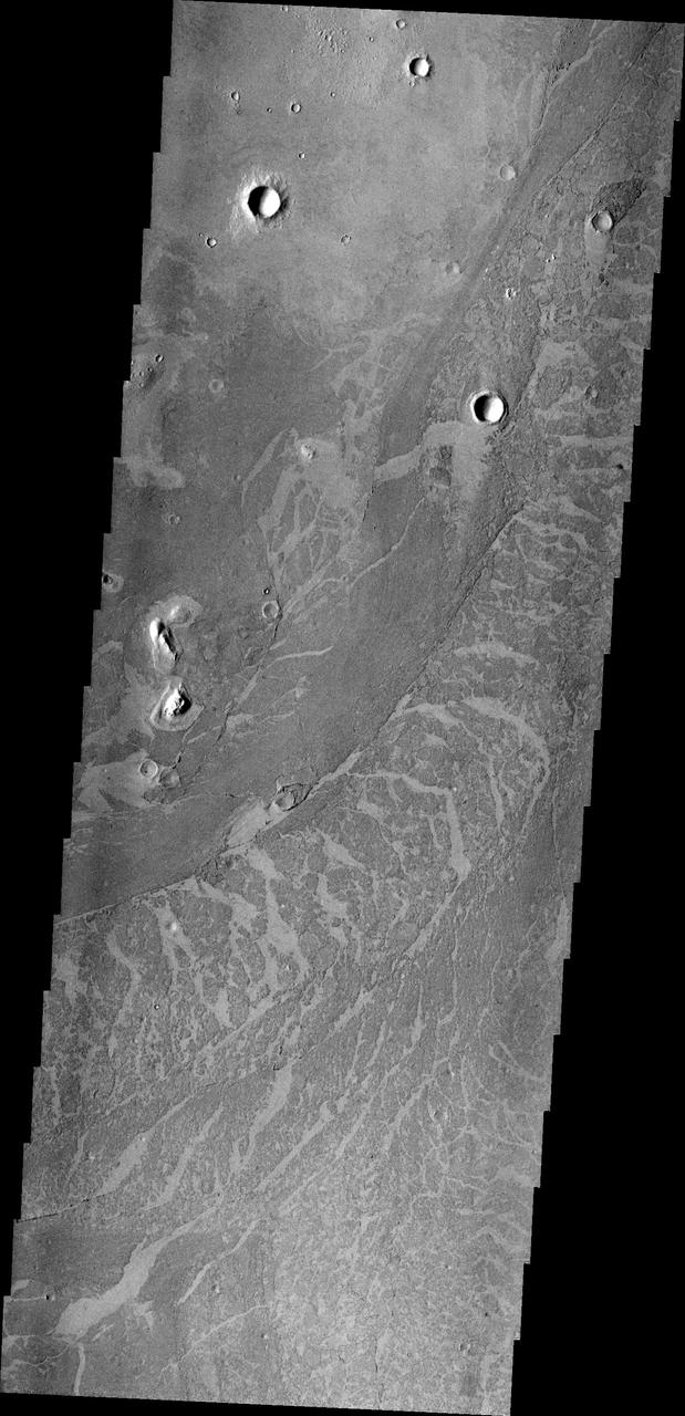 These lava flows in Elysium Planitia captured by NASA Mars Odyssey are called platy flows. The surface of the lava flow cooled and solidified, while liquid lava beneath kept flowing.