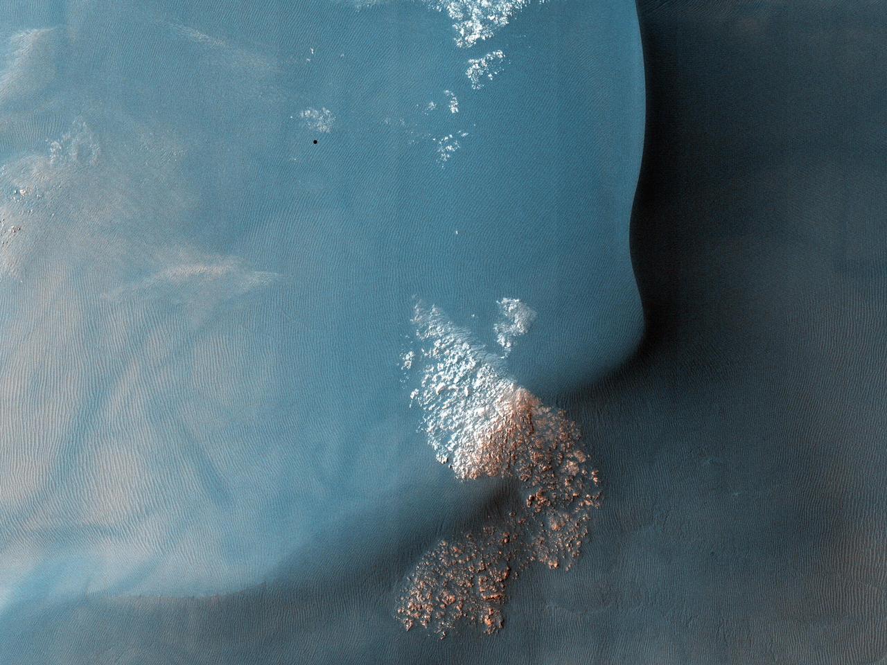 This observation from NASA Mars Reconnaissance Orbiter shows a Southern hemisphere crater with gullies, dunes, periglacial modification, bright rock deposits, and dust devil tracks.