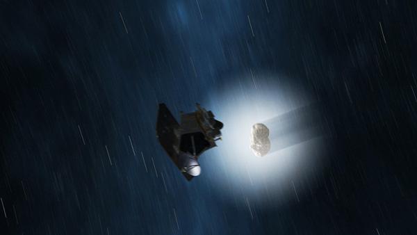 This artist concept shows a view of NASA EPOXI mission spacecraft during its Nov. 4, 2010 flyby of comet Hartley 2. The fluffy shell around the comet, called a coma, is made up of gas and dust that blew off the comet core, or nucleus. 