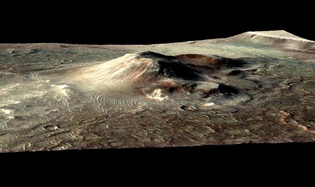 This false color image from NASA Mars Reconnaissance Orbiter indicates that the volcanic cone in the Nili Patera caldera on Mars has hydrothermal mineral deposits on the southern flanks and nearby terrains.