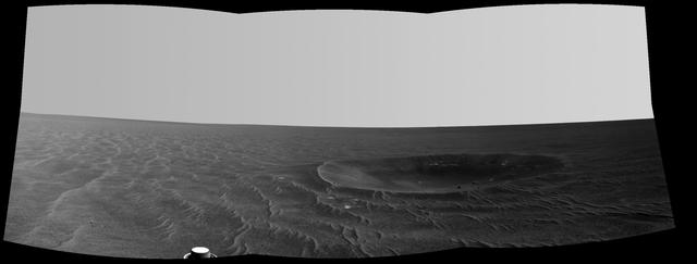 This mosaic is a view from NASA Mars Exploration Rover Opportunity of Yankee Clipper crater which carries the name of the command and service module of NASA 1969 Apollo 12 mission to the moon.