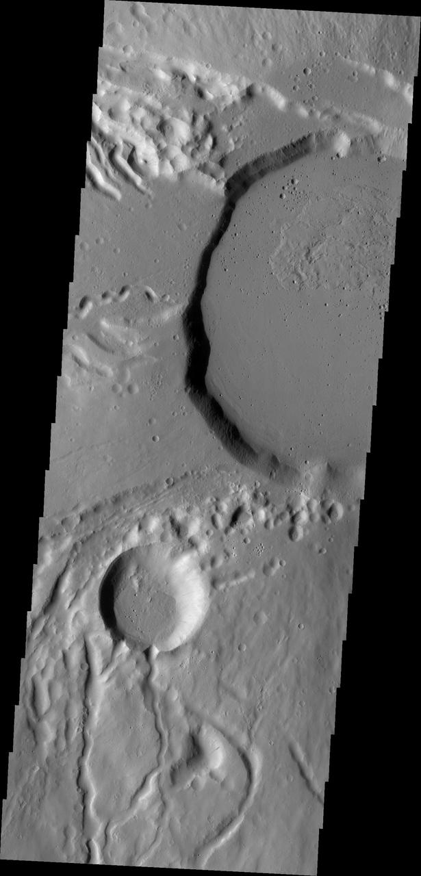 This image from NASA Mars Odyssey shows part of the summit caldera of Ceraunius Tholus, one of the smaller volcanoes of the Tharsis region.