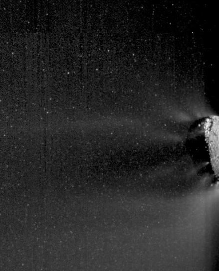 Images obtained by NASA EPOXI mission spacecraft show an active end of the nucleus of comet Hartley 2. Icy particles spew from the surface. Most of these particles are traveling with the nucleus; fluffy nowballs about 3 centimeters to 30 centimeters.