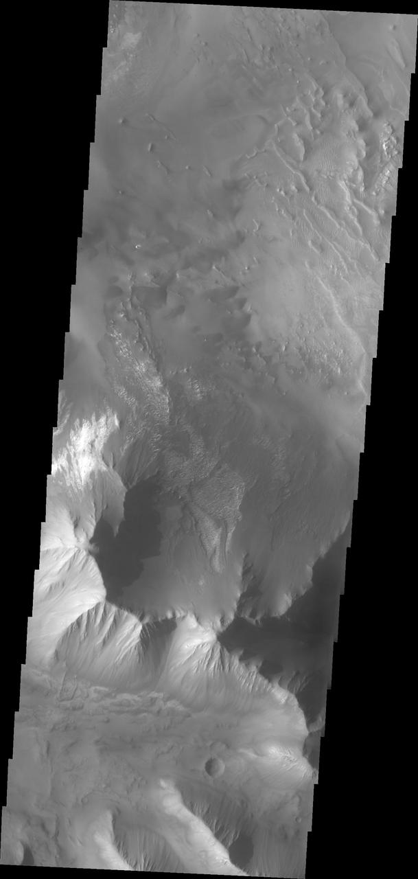 This image from NASA Mars Odyssey shows a portion of Tithonium Chasma, part of western Valles Marineris.