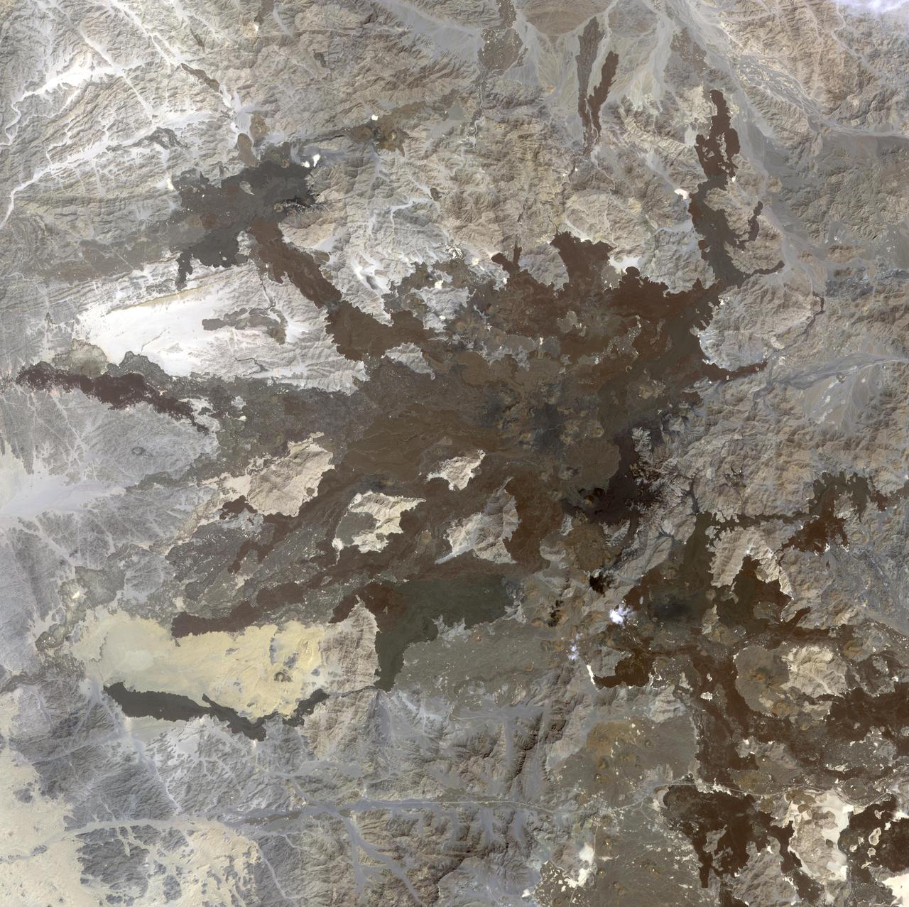 This image from NASA Terra spacecraft shows a northwest area of Saudi Arabia, Harrat Lunayyir, that reveals that the area is unexpectedly volcanically active.