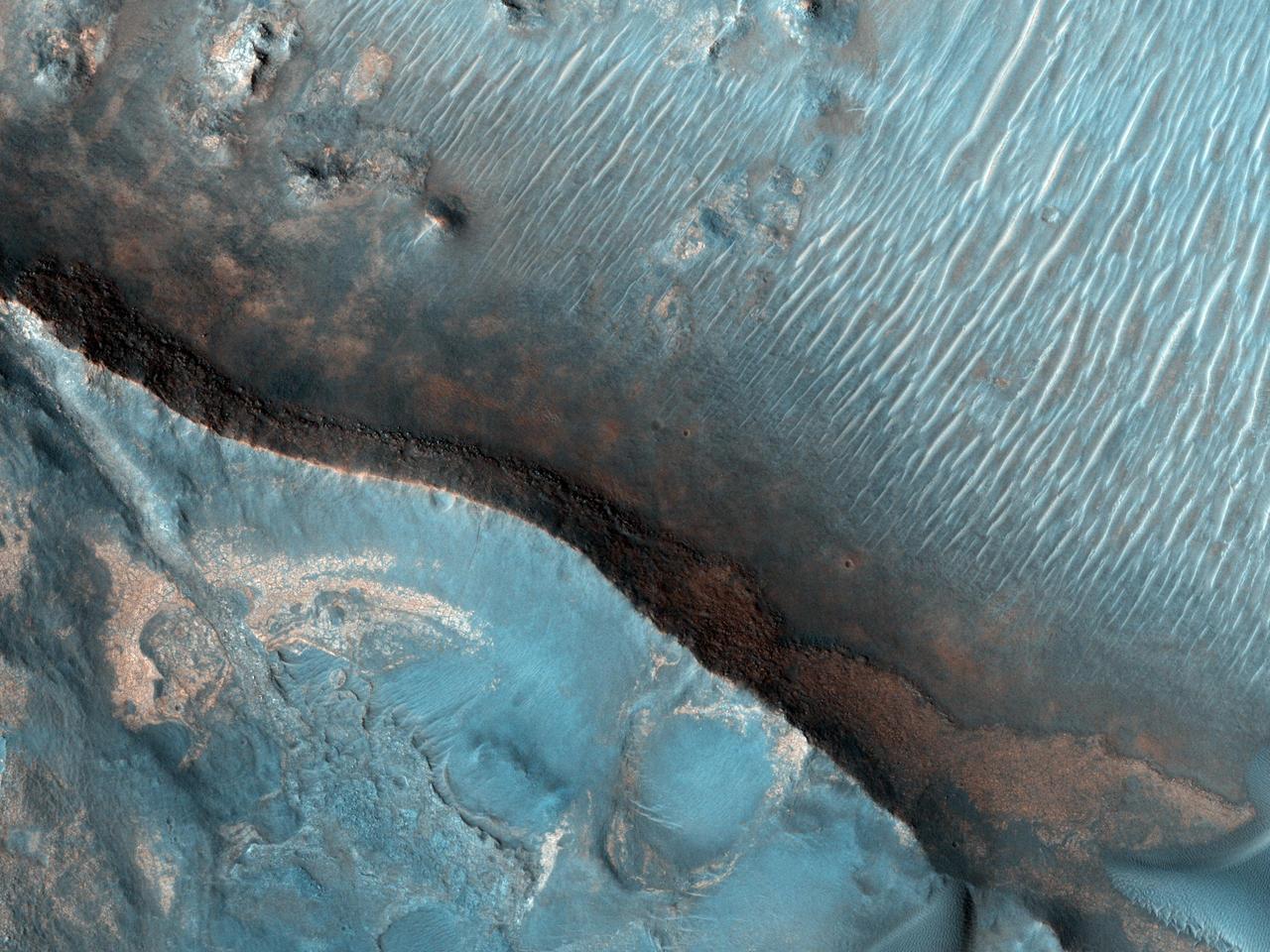 This image from NASA Mars Reconnaissance Orbiter shows Nili Fossae region of Mars, one of the largest exposures of clay minerals, and a prime candidate landing site for Mars Science Laboratory rover, Curiosity.