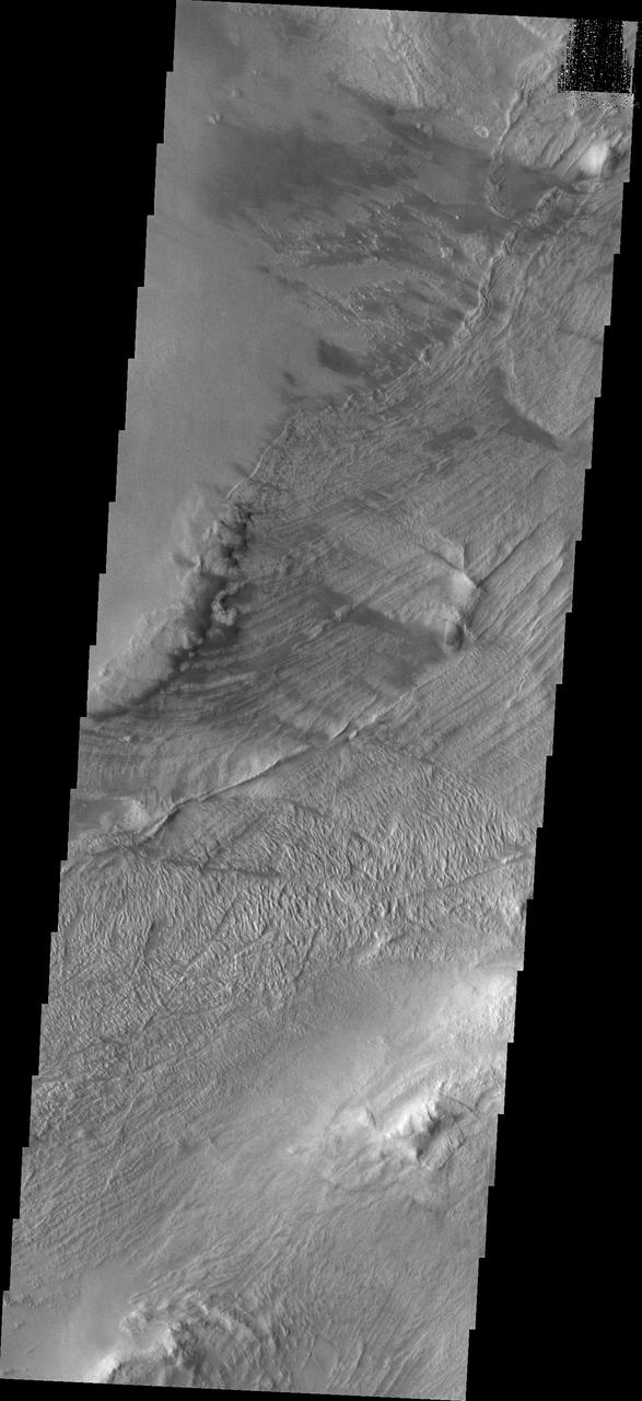This image captured NASA Mars Odyssey shows part of a landslide deposit in Melas Chasma.