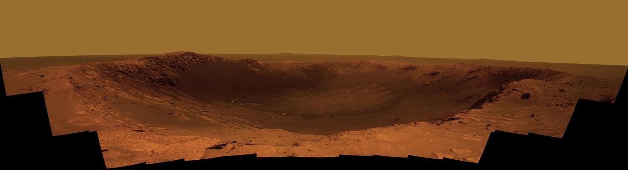 NASA Mars Exploration Rover Opportunity is spending the seventh anniversary of its landing on Mars investigating a crater called Santa Maria, which has a diameter about the length of a football field. This scene looks eastward across the crater.