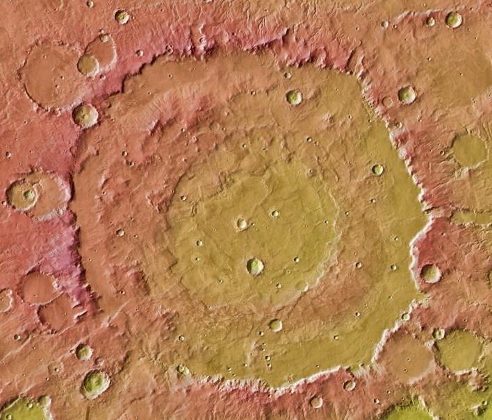 This image from NASA Mars Global Surveyor and Mars Odyssey spacecraft shows the context for orbital observations of exposed rocks that had been buried on Mars. The area is dominated by the Huygens crater, which is about the size of Wisconsin.
