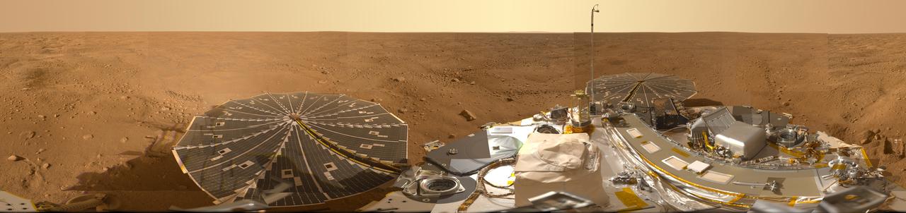 This view combines hundreds of images taken during the first several weeks after NASA Phoenix Mars Lander arrived on an arctic plain on Mars. The landing was on May 25, 2008.