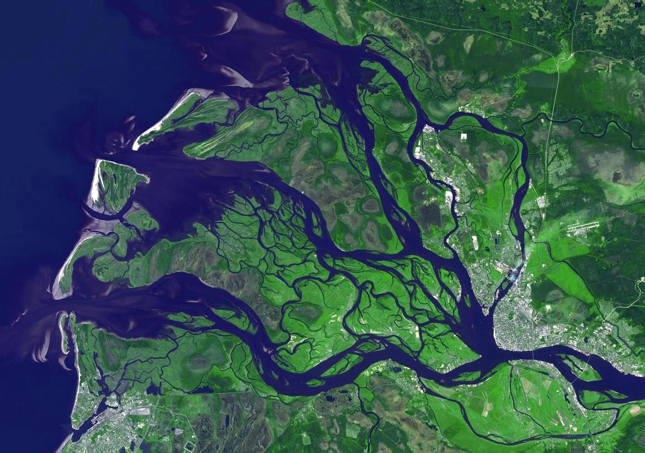 NASA Terra spacecraft captured this image of the city of Arkhangelsk or Archangel in English and administrative capital of Archangelsk Oblast, Russia. It is situated on both banks of the Dvina River near where it flows into the White Sea.
