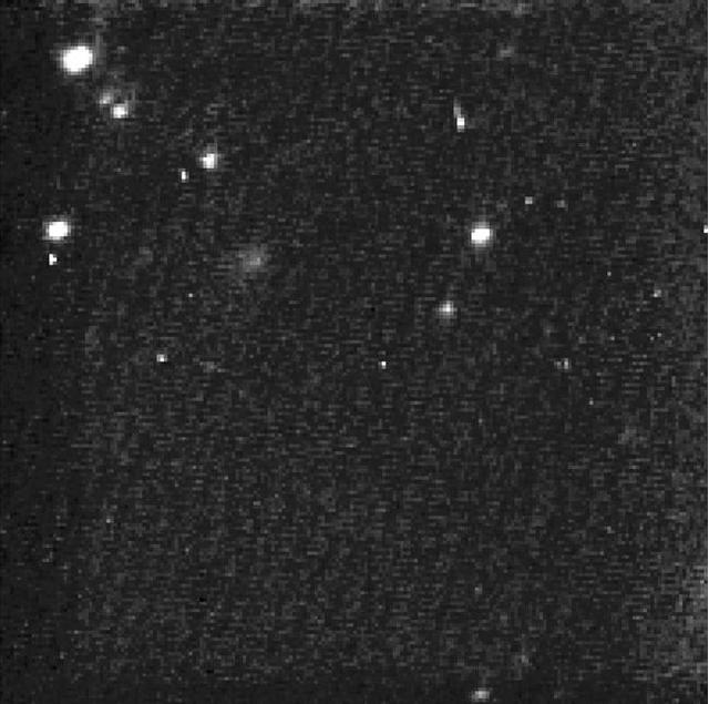 This composite image is the first taken by NASA Stardust spacecraft navigation camera. The observations were made on Jan. 18 and 19, 2011. Stardust will fly within about 200 kilometers 124 miles of the comet nucleus.