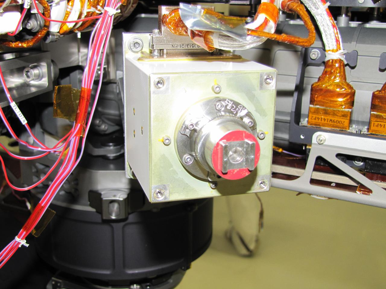 The sensor head on the Alpha Particle X-ray Spectrometer instrument was installed during testing at NASA Jet Propulsion Laboratory. The instrument is part of NASA Curiosity rover.