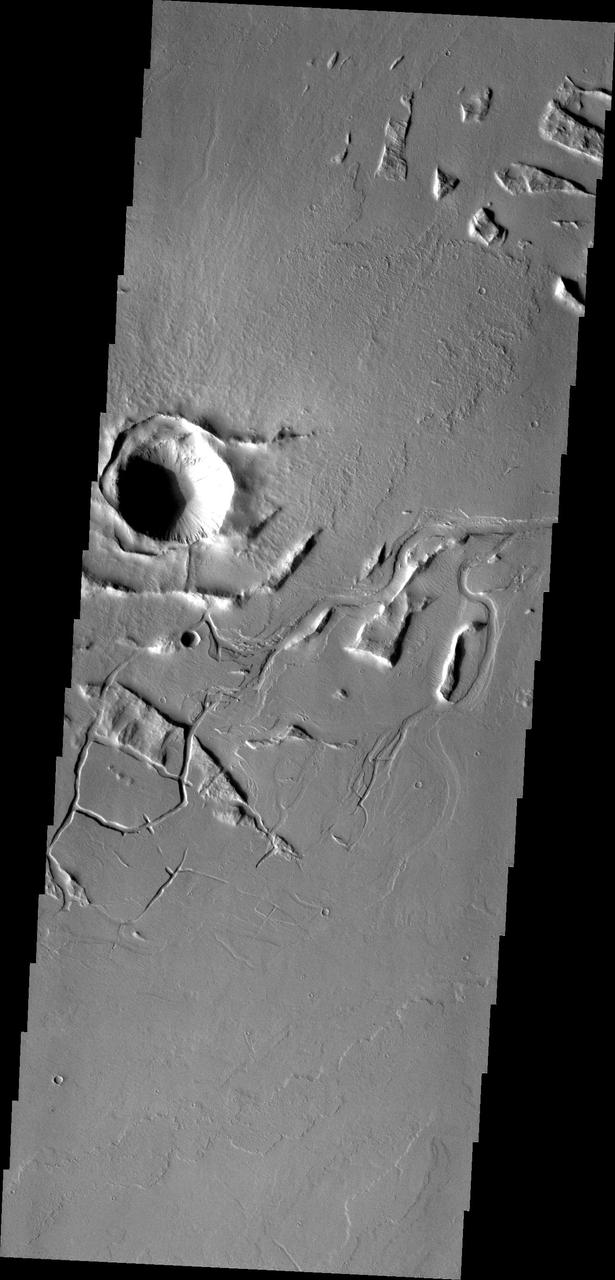 Lava channels and tectonic fractures are both found in the Tharsis region as shown in this image from NASA Mars Odyssey.