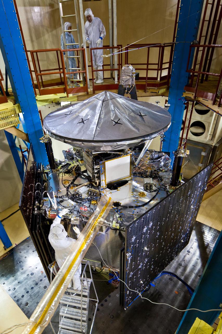 Technicians inspect NASA Juno spacecraft and its science instruments following acoustics testing at Lockheed Martin Space Systems in Denver, Colo. on Jan. 26, 2011.