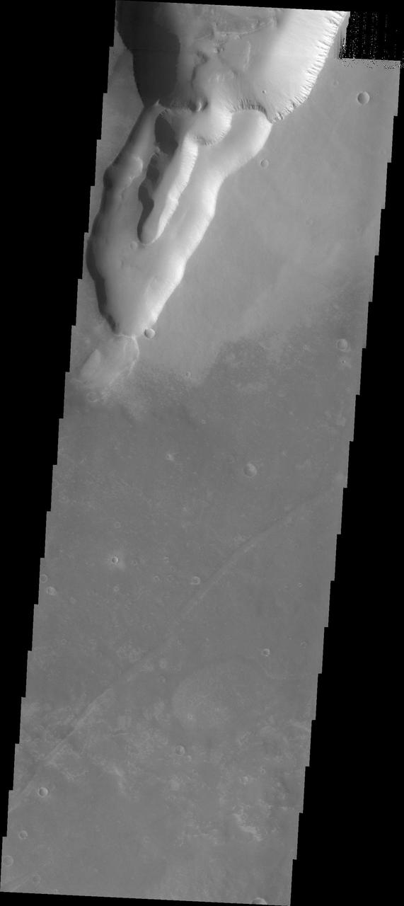 This huge or mega gully is part of Noctis Labyrinthus as seen by NASA Mars Odyssey. Located on the western end of Valles Marineris, Noctis Labyrinthus is a huge region of tectonically controlled valleys.