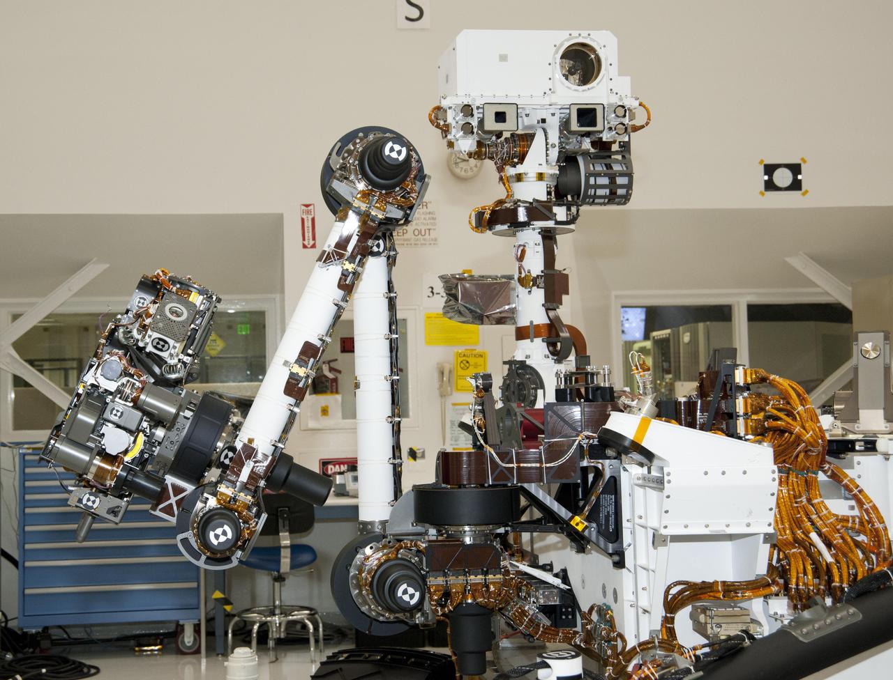 The arm and the remote sensing mast of the Mars rover Curiosity each carry science instruments and other tools for NASA Mars Science Laboratory mission. This image shows the arm on the left and the mast just right of center.