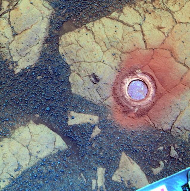 NASA Mars Exploration Rover Opportunity used its rock abrasion tool on a rock informally named Gagarin. This false-color image shows the circular mark created where the tool exposed the interior of the rock at a target called Yuri.