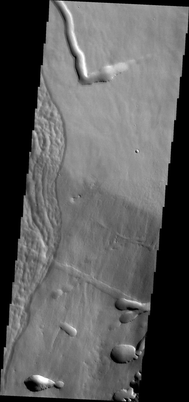 This image captured by NASA Mars Odyssey shows a portion of the flank of Pavonis Mons.