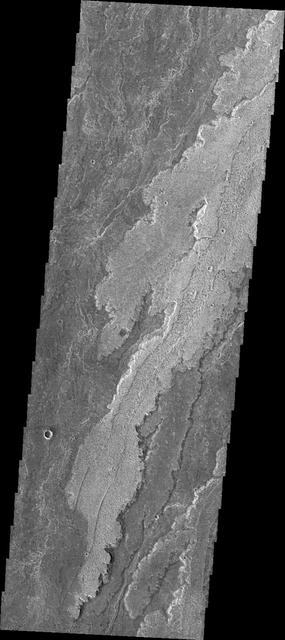 The volcanic flows in Daedalia Planum originated from Arsia Mons. This image from NASA Mars Odyssey shows a tiny portion of Daedalia Planum.