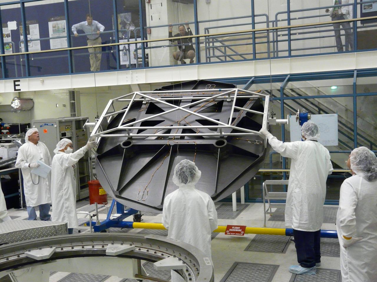 Engineers test Aquarius 2.5 meter reflector in the clean room at NASA Jet Propulsion Laboratory in Pasadena, Calif.