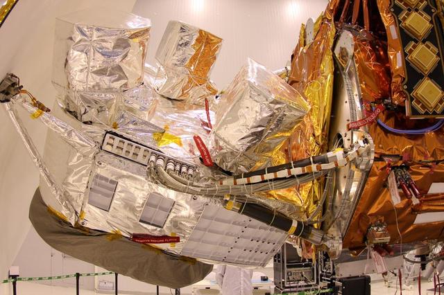 NASA Aquarius instrument, covered in silver foil, is shown attached to the SAC-D satellite bus at INVAP facility.