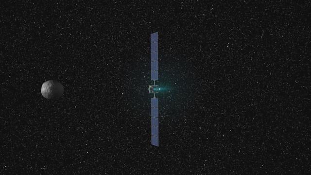 This frame from a movie presents a series of animations showing NASA Dawn spacecraft traveling to and operating at the giant asteroid Vesta. 