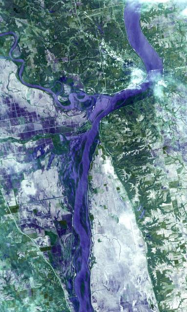 NASA Terra spacecraft acquired this image on April 30, 2011, showing flooding along the Mississippi River at its junction with the Des Moines River near Keokuk, Iowa.