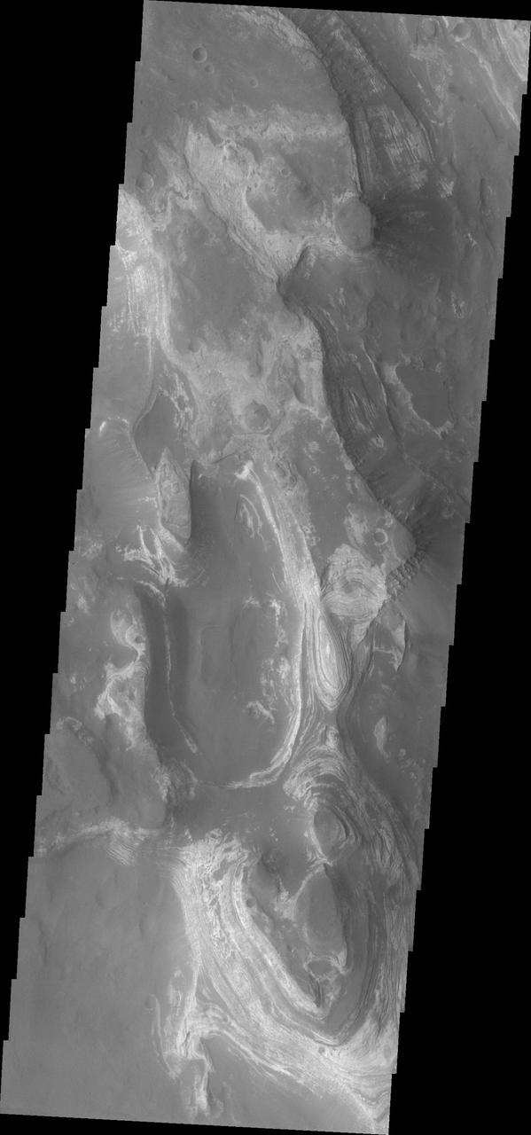 This image from NASA 2001 Mars Odyssey shows a huge ridge of sand in Russell Crater that makes its dune field one of the most unusual on Mars.