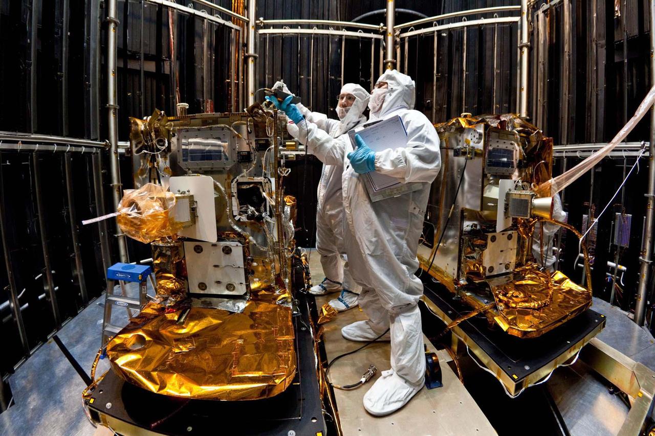 In this photo, taken April 29, 2011, technicians install lifting brackets prior to hoisting the 200-kilogram 440-pound GRAIL-A spacecraft out of vacuum chamber after testing.