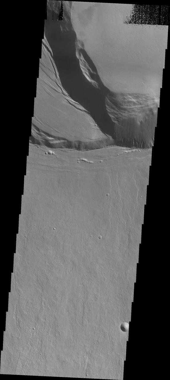 This image captured by NASA 2001 Mars Odyssey shows the southern summit caldera of Ascraeus Mons.