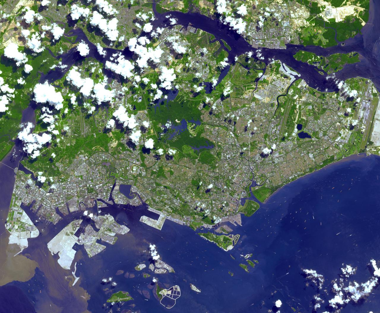 This image from NASA Terra spacecraft is of the Republic of Singapore, a city-state off the southern tip of the Malay Peninsula. An island country made up of 63 islands, the country is largely urbanized with very little rain forest left.
