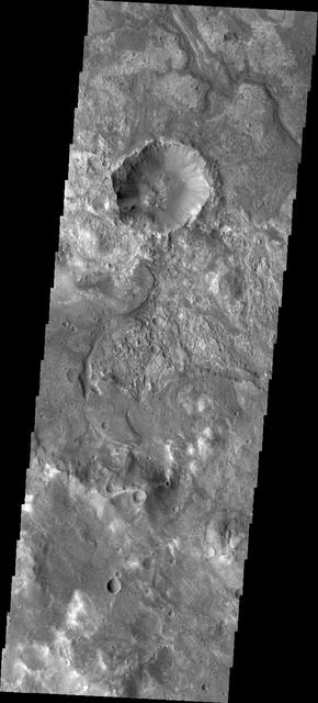 It is sometimes difficult to figure out the history of the surface of Mars as seen in visible wavelength images. This image from NASA 2001 Mars Odyssey is located on the northern margin of Hellas Basin and hints at a layered surface.