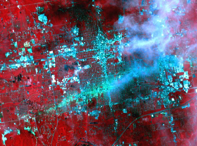 On May 30, 2011, a week after an EF-5 tornado swept through the city of Joplin, Mo, NASA Terra spacecraft captured this image showing the track of the deadly tornado through the city shown horizontally in green-blue.