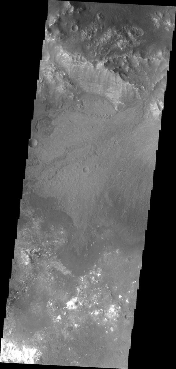 A beautiful delta deposit in Harris Crater is the highlighted feature in this image captured by NASA 2001 Mars Odyssey.