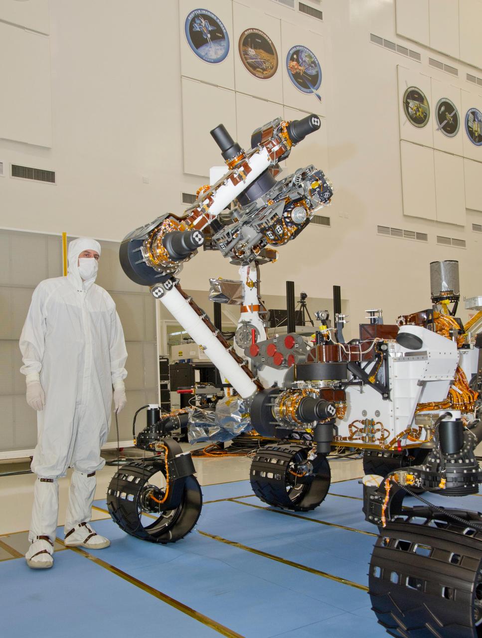 This photograph of the NASA Mars Science Laboratory rover, Curiosity, was taken during testing on June 3, 2011. The turret at the end of Curiosity robotic arm holds five devices.