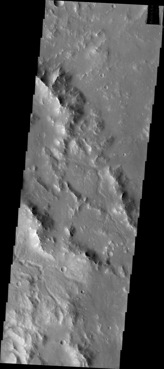 Small channels dissect the rim of Bakhuysen Crater in Noachis Terra as seen by NASA 2001 Mars Odyssey.