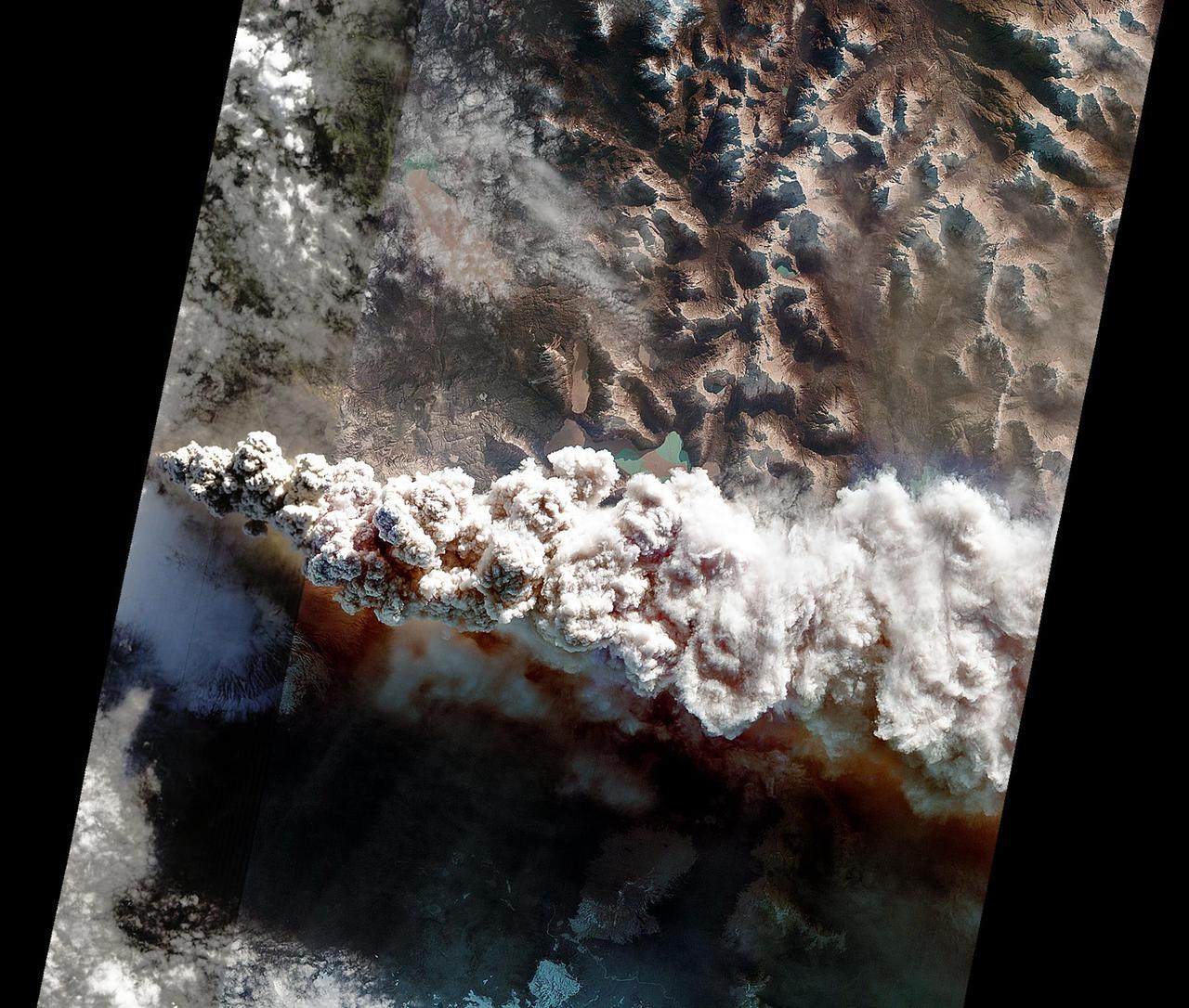 On June 14, 2011, NASA Earth Observing-1 EO-1 spacecraft obtained this image showing ash-rich volcanic plume billowing out of the vent, punching through a low cloud layer. The plume grey color is a reflection of its ash content.