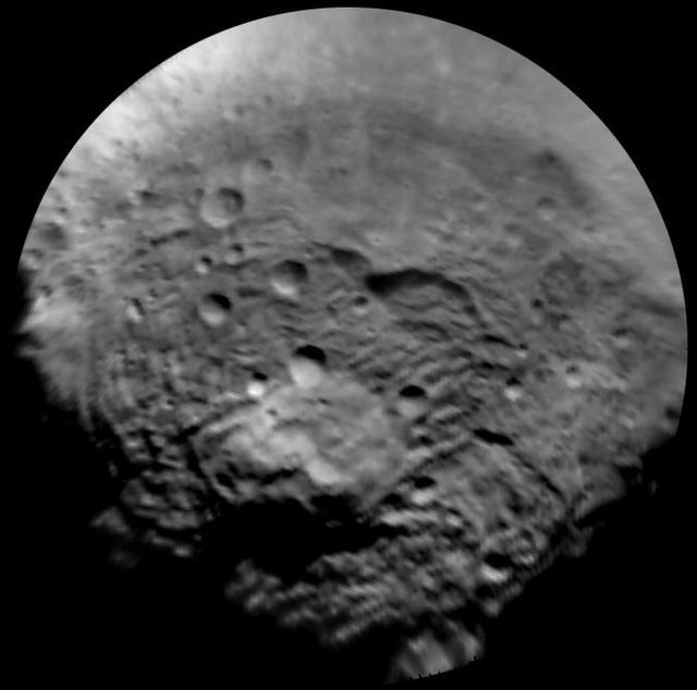 This enhanced image, taken by the framing camera instrument aboard NASA Dawn spacecraft on July 9, 2011, views the south polar region of this giant asteroid.