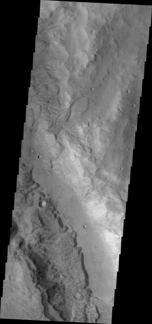 This image from NASA 2001 Mars Odyssey spacecraft shows a small portion of Maadim Vallis. This channel intersects Gusev Crater, home of the Spirit Rover.