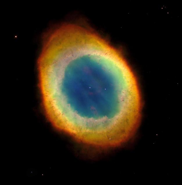 NASA Hubble Space Telescope captured this sharpest view yet of the most famous of all planetary nebulae: the Ring Nebula M57. The colors are approximately true colors.