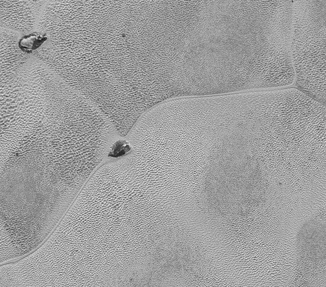 This mosaic strip, extending across the hemisphere that faced the New Horizons spacecraft as it flew past Pluto on July 14, 2015, now includes all of the highest-resolution images taken by the NASA probe.