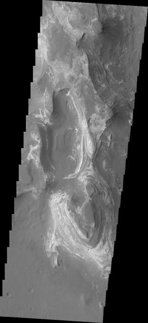This image shows from NASA 2001 Mars Odyssey spacecraft some of the layered deposits in Terby Crater.
