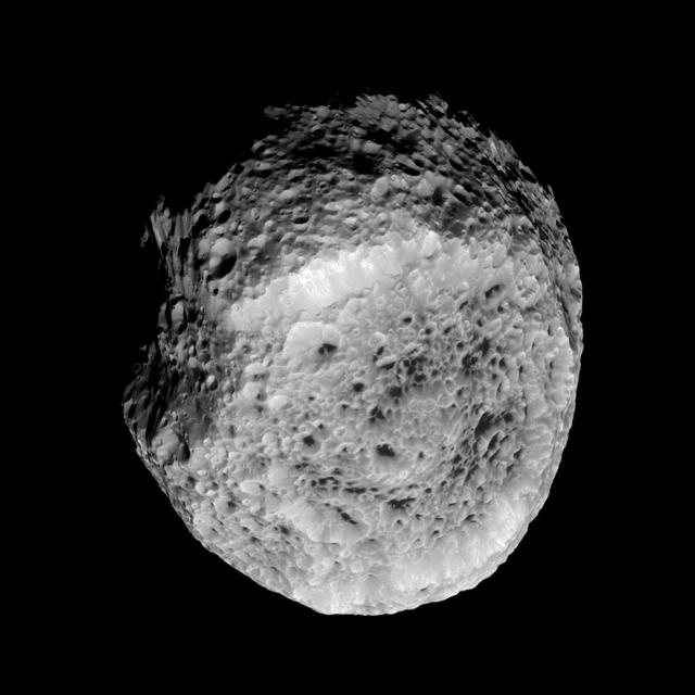 NASA Cassini spacecraft looks at Saturn highly irregular moon Hyperion in this view from the spacecraft flyby of the moon on Aug. 25, 2011.