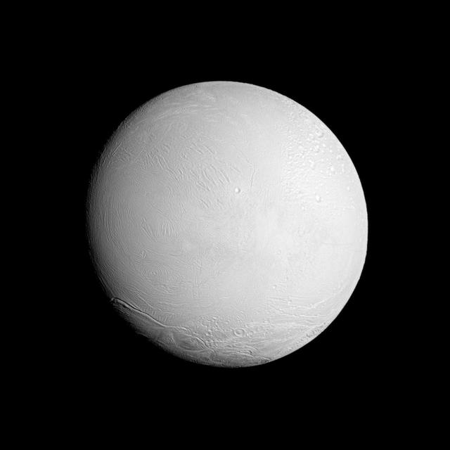 NASA Cassini spacecraft looks at a brightly illuminated Enceladus and examines the surface of the leading hemisphere of this Saturnian moon.