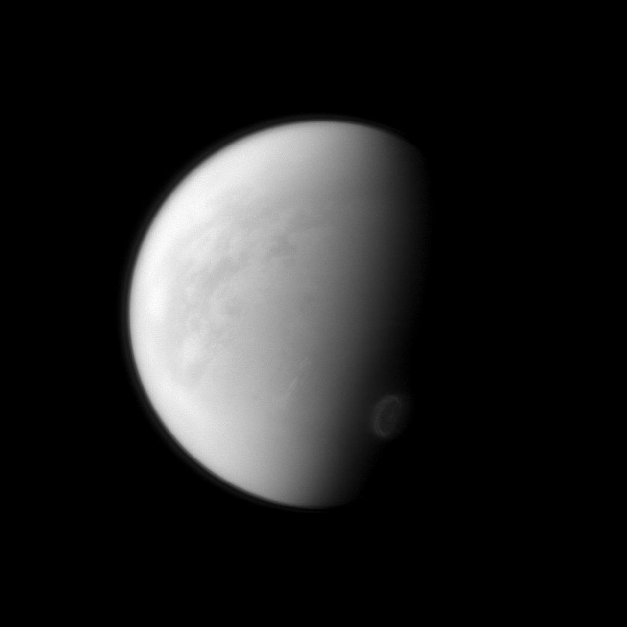 Titan swirling south-polar vortex stands out brightly against the other clouds of the south pole lower right in this image captured by NASA Cassini spacecraft.