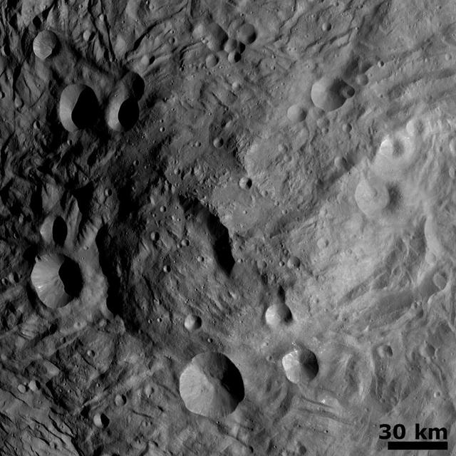 NASA Dawn spacecraft obtained this image of a central mound in a large structure at the south pole of asteroid Vesta with its framing camera on August 12, 2011. This image was taken through the camera clear filter.
