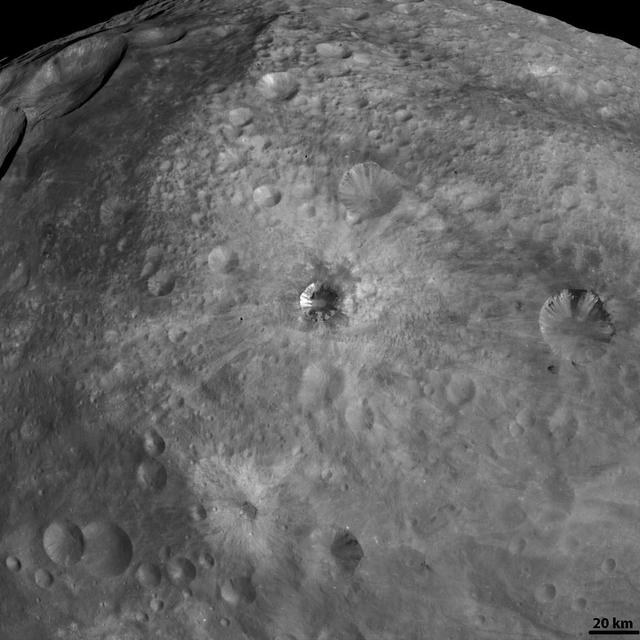 NASA Dawn spacecraft obtained this image of various craters on asteroid Vesta with its framing camera on August 19, 2011. The image has a resolution of about 260 meters per pixel.
